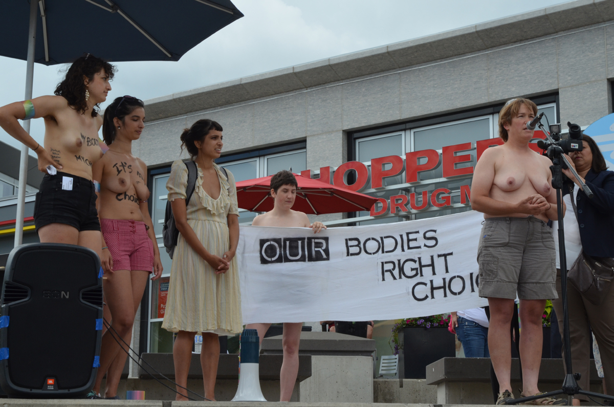 Gwen Jacob speaking at a Kitchener-Waterloo topfree rally in 2015