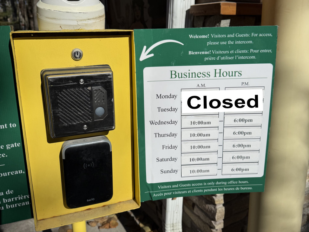 The front gate sign showing the hours